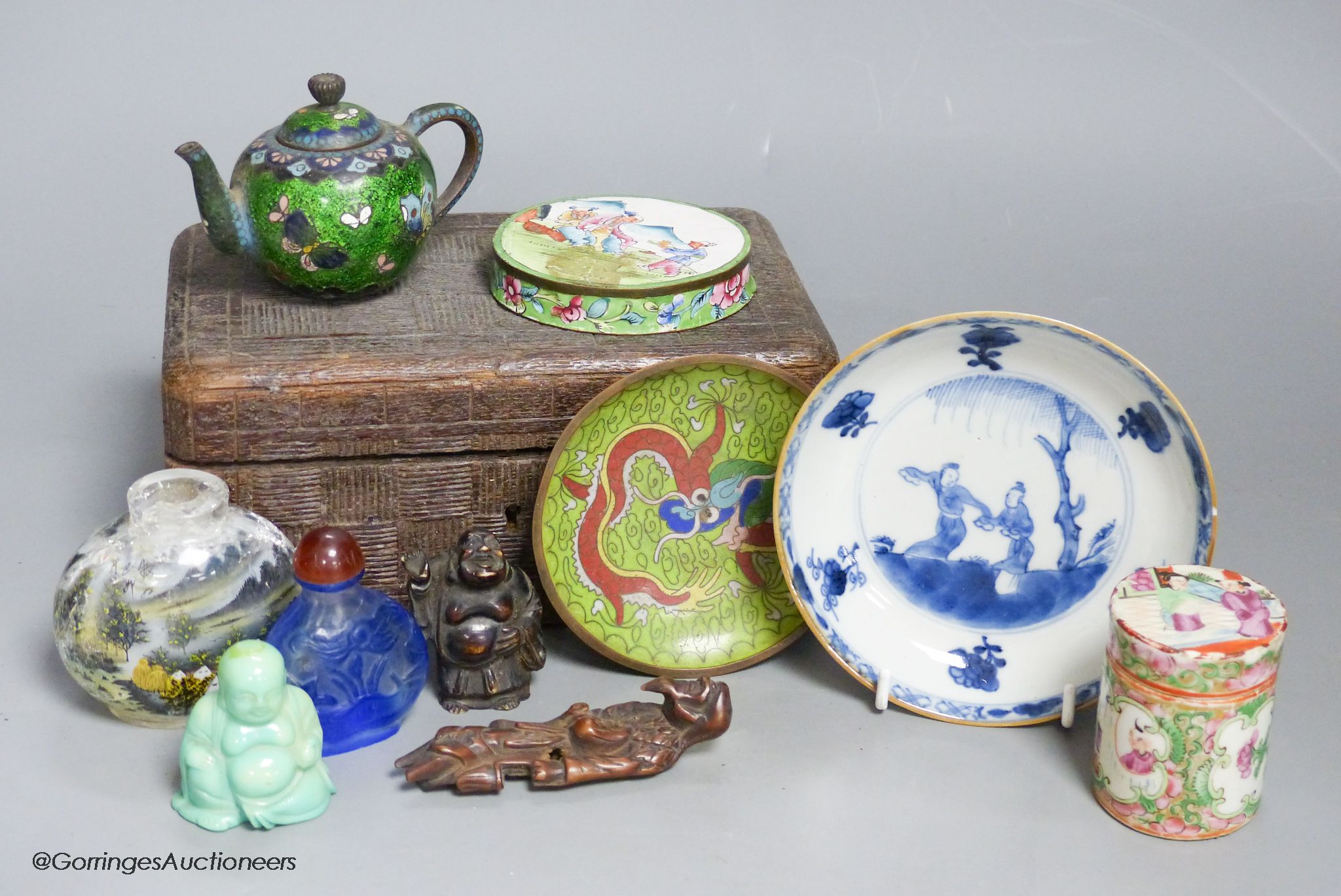 A small miscellaneous Oriental collection including enamel snuff boxes, Buddha carvings etc.